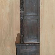 Jacobean hardwood library with carved panels and glass doors.