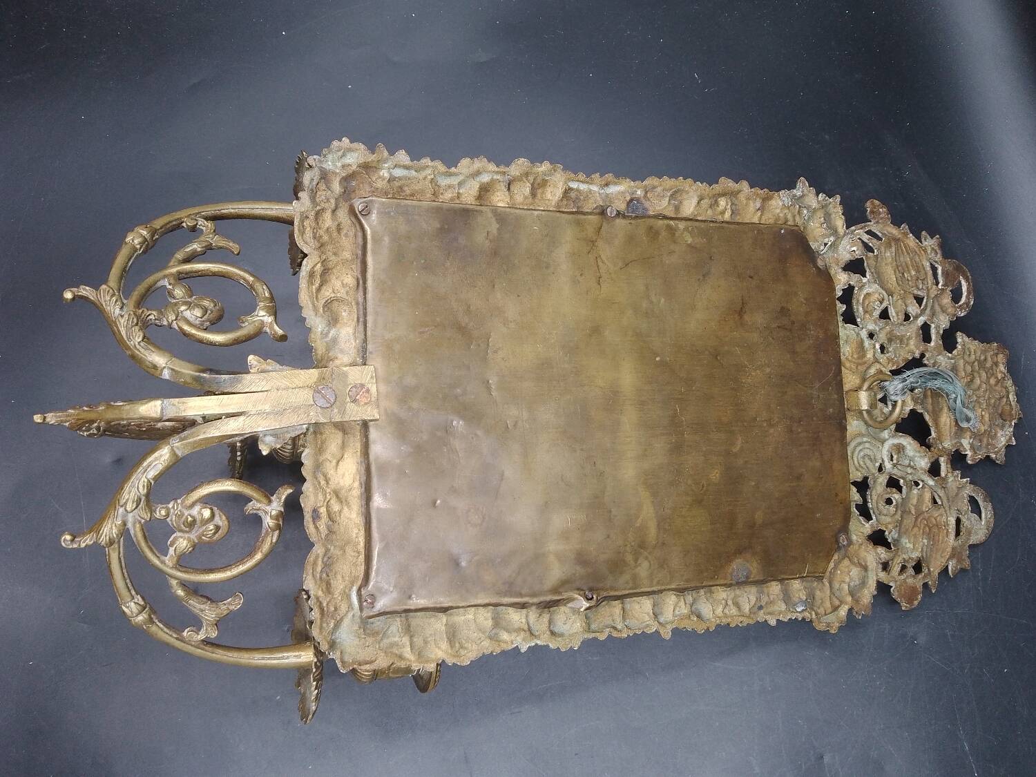 Repousse brass wall mirror with three candles, beveled glass, end of 19th century, double eagles