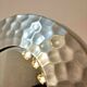 Miroir rond en aluminium martelé, maison Deknudt, distribué par Homka