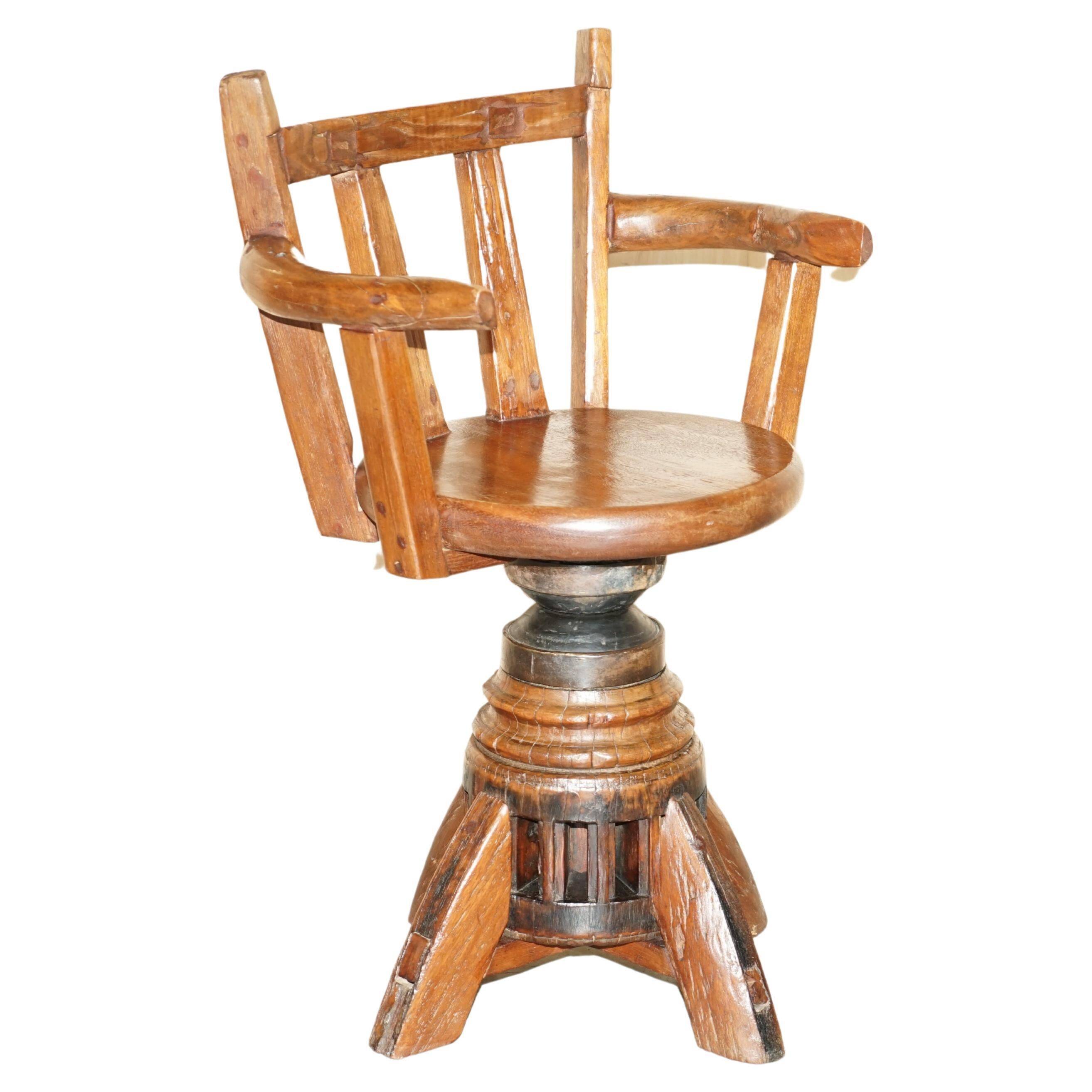 Antique captain's swivel chair on a draft horse wheel from around 1760.