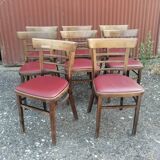 Set of 8 bistro chairs in vintage red wood and leatherette.