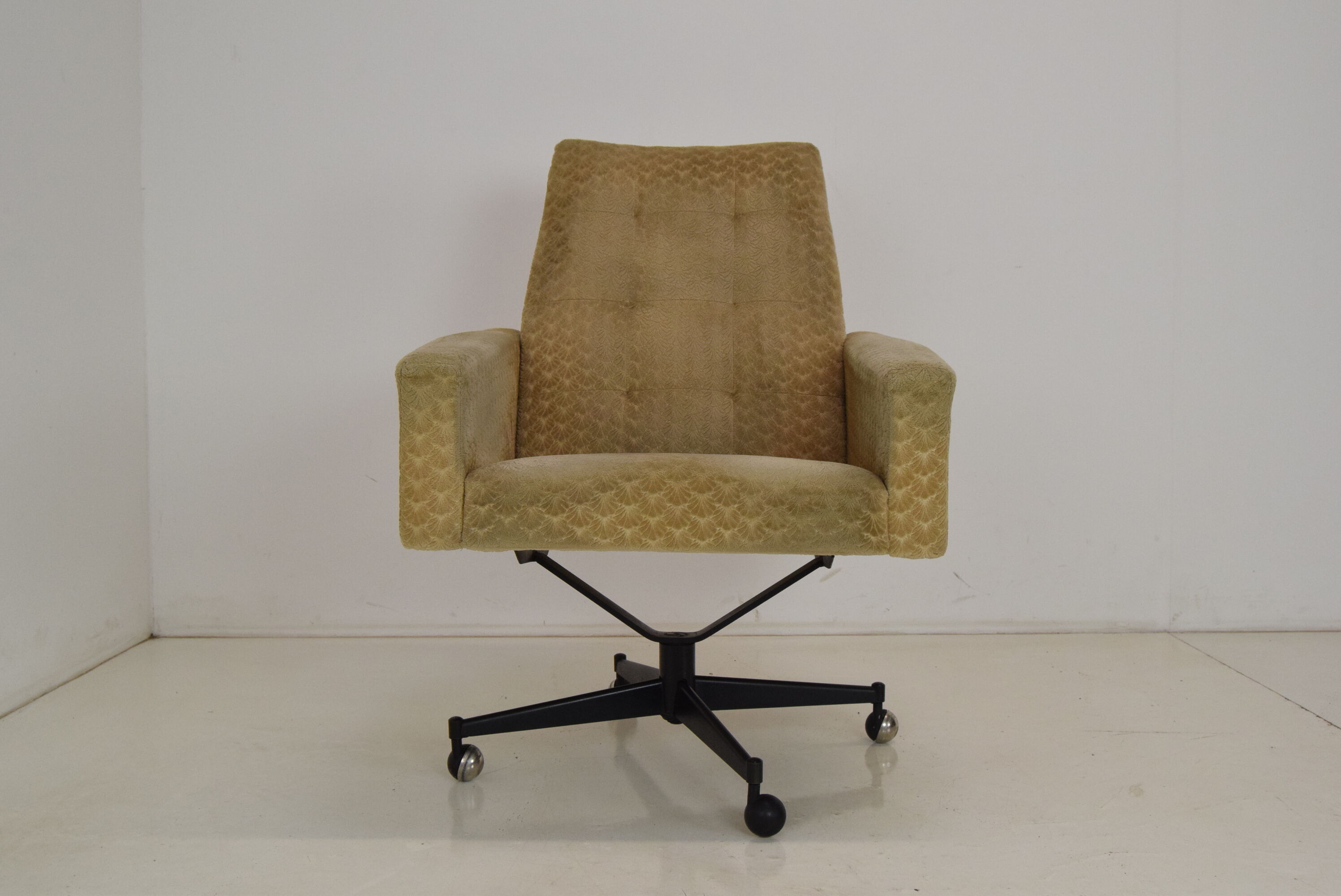 Mid-century swivel armchair with wheels 1970's