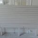 Headboard of 160 made with aged wood in pearl grey patina.