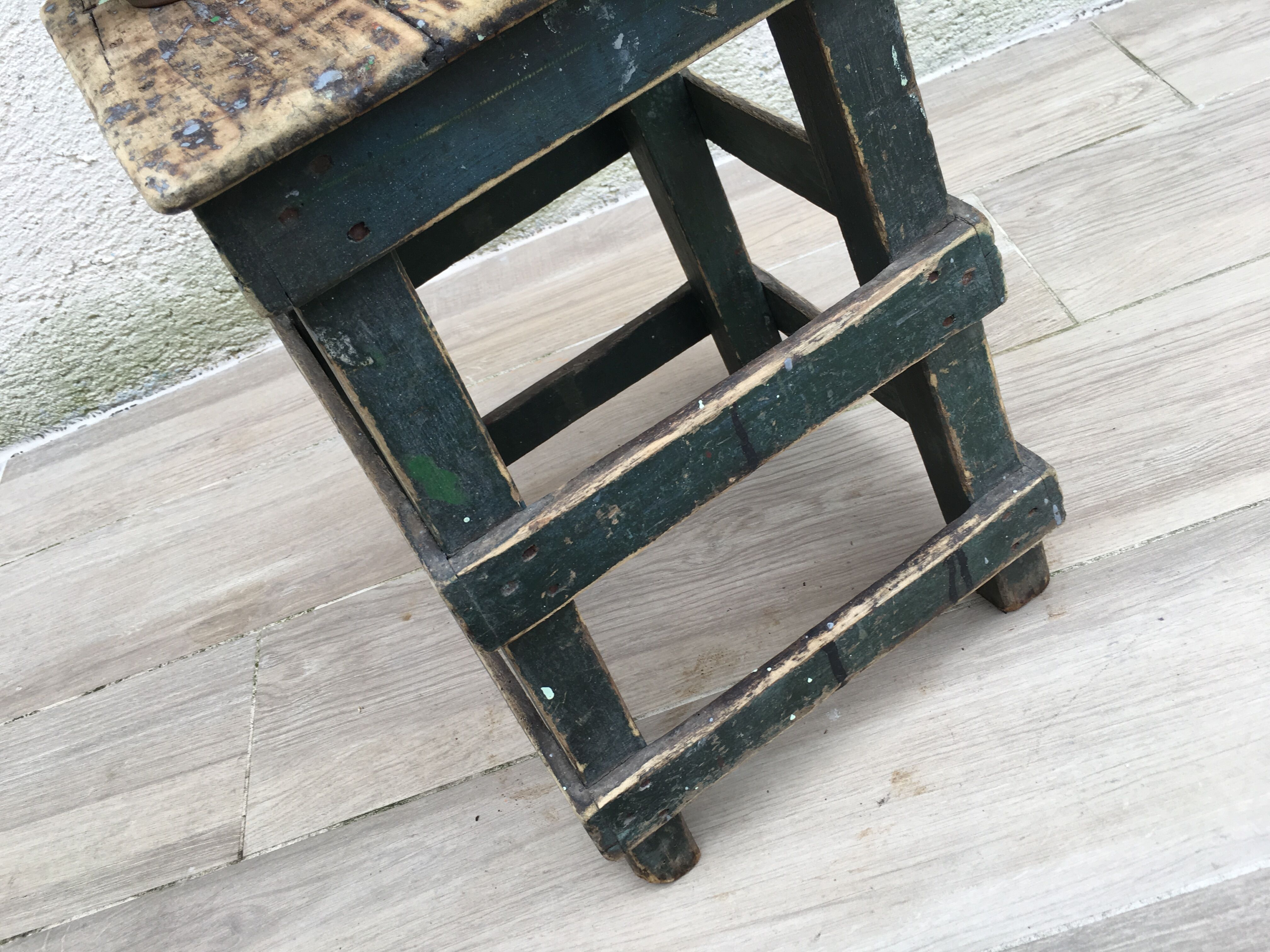 Former green workshop stool