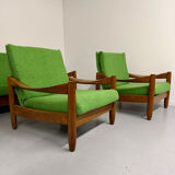 Living room sofa and Scandinavian design armchairs from the 1960s in green boucle.