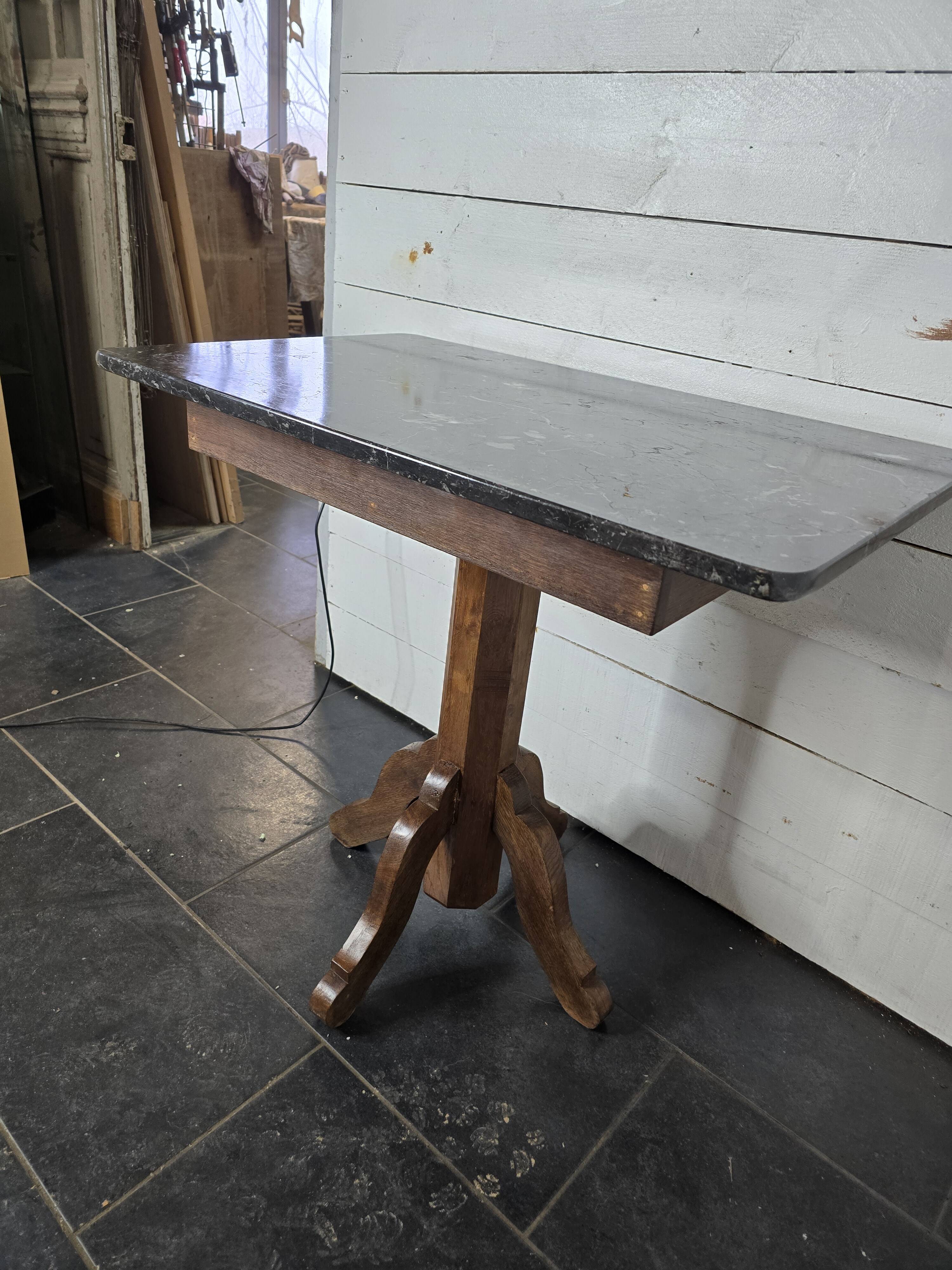 Old pedestal table with oak legs and marble top