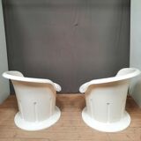 Pair of white plastic armchairs