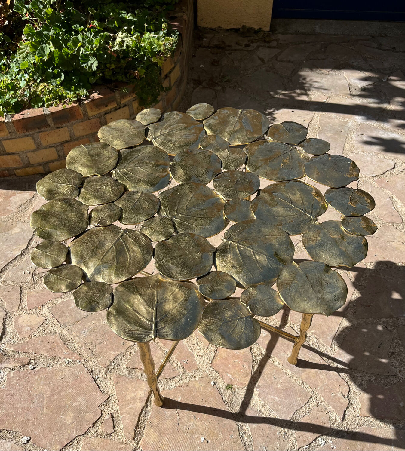 Carved brass coffee table with ginkgo decor