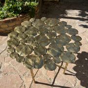 Carved brass coffee table with ginkgo decor