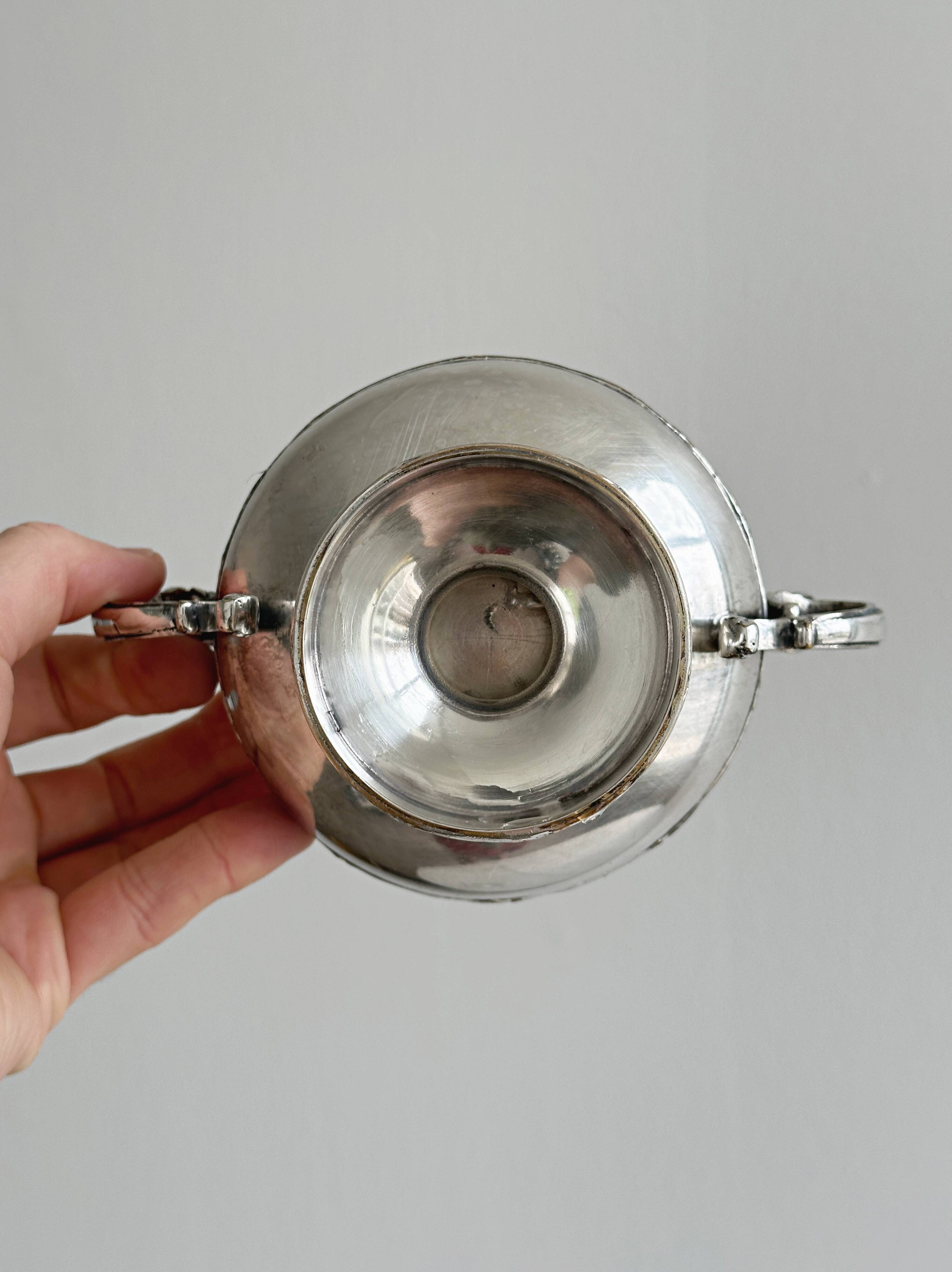 Metal and glass pedestal bowl