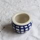 Vintage ceramic cache-pot with navy blue gingham pattern.