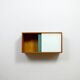 A vintage mid-century wall hung oak cabinet, green & white glass doors