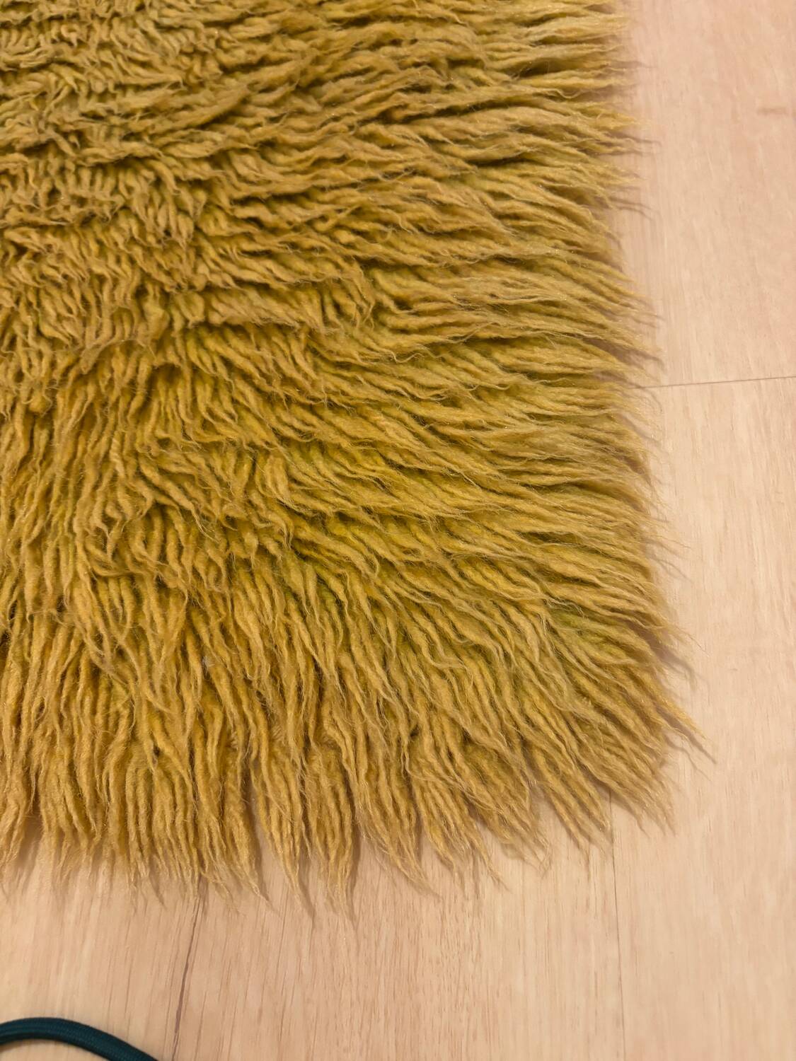 Large handmade wool rug from the 70s in lime green.