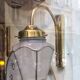 Pair of 1960 brass wall lamps and gilded frosted glass