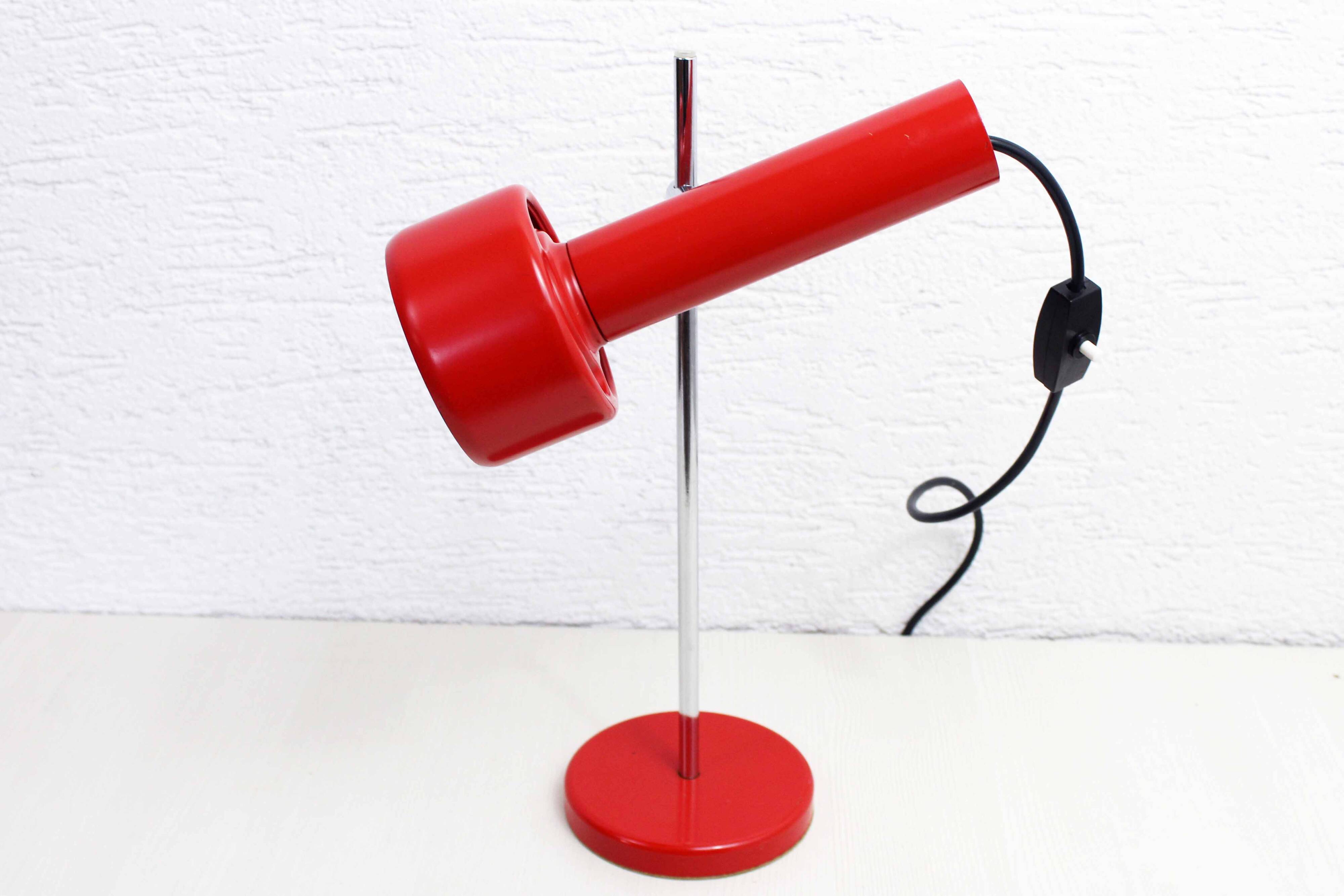 Red metal articulated desk lamp