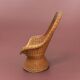 Fauteuil vintage en osier tressé
