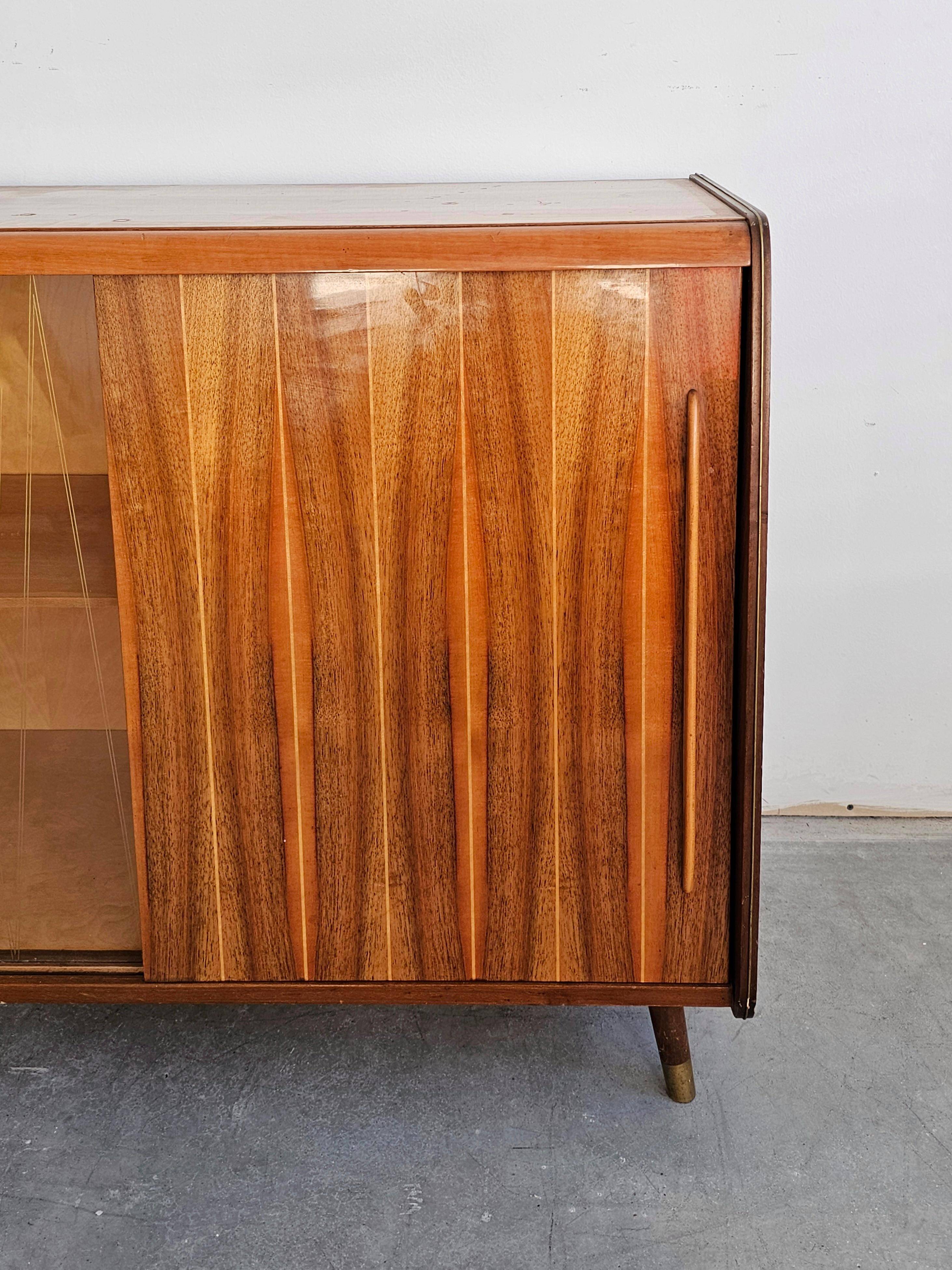 Mid-Century Modern walnut buffet with two compartments.