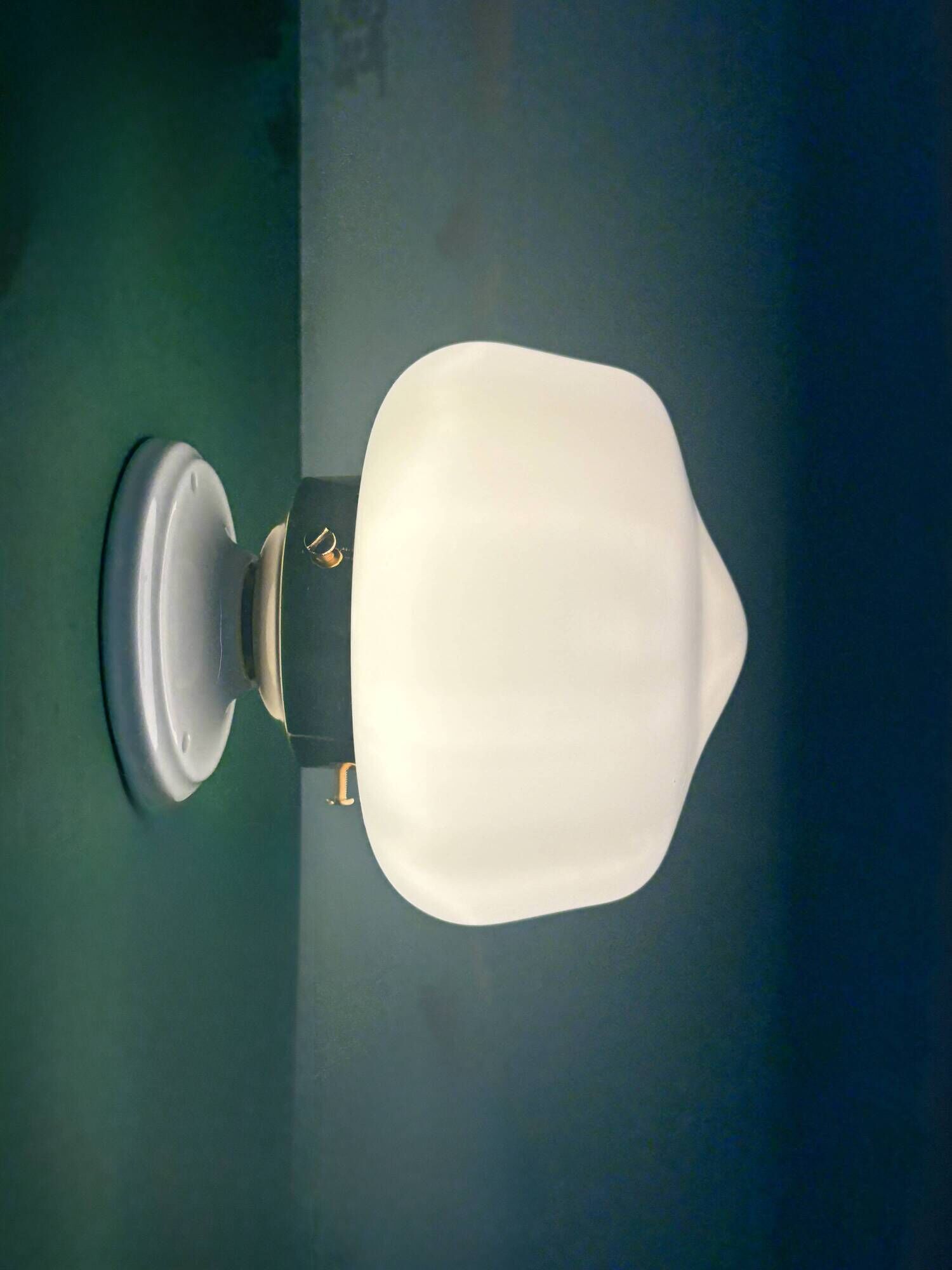 Vintage Art Deco globe wall light in white opaline.