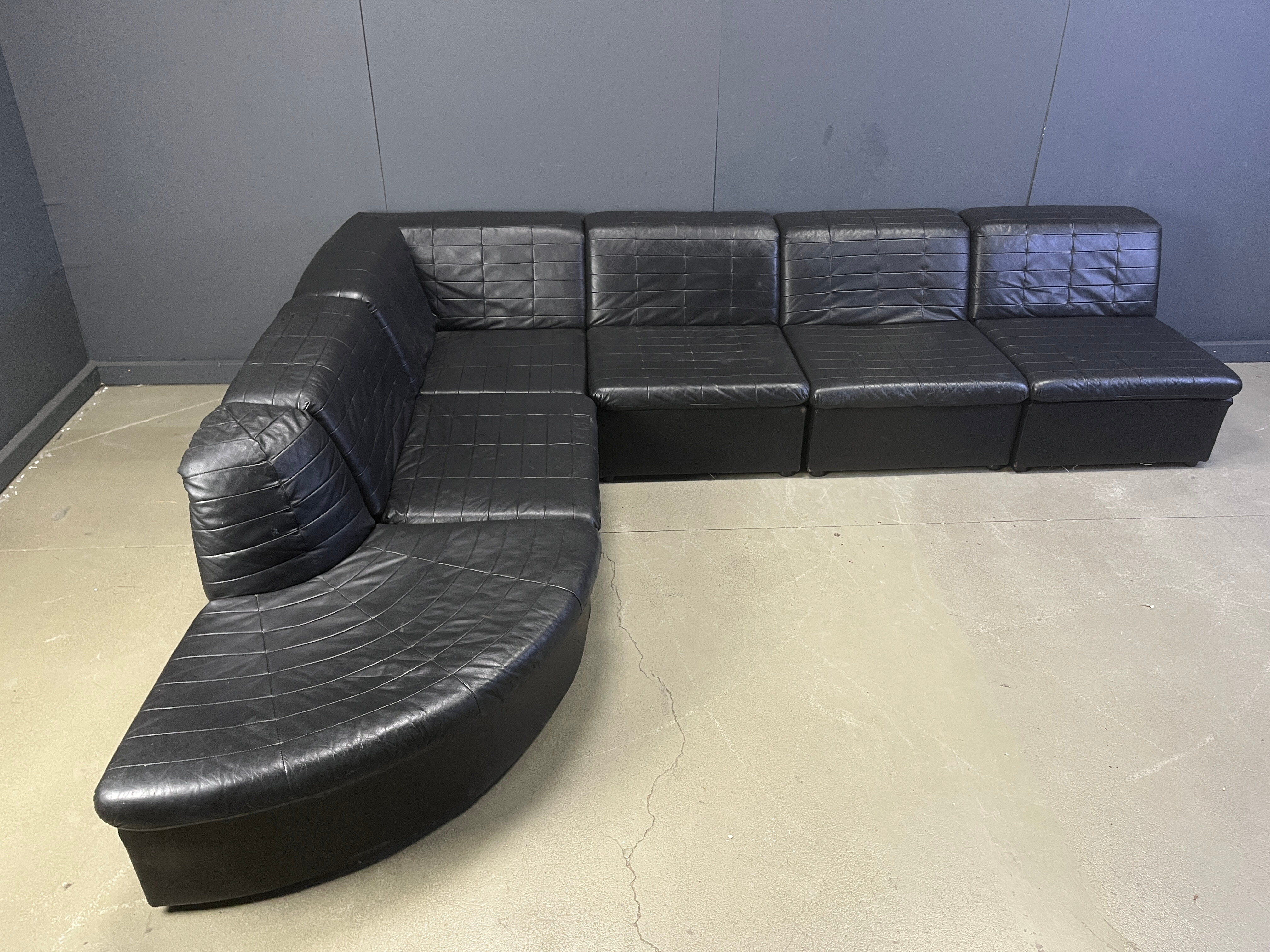 Vintage black patchwork leather modular sofa set by Laauser, 1970s