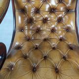 Pair of padded Chesterfield armchairs