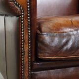 Vintage sheepskin armchair with beautiful warm colors and excellent seating comfort