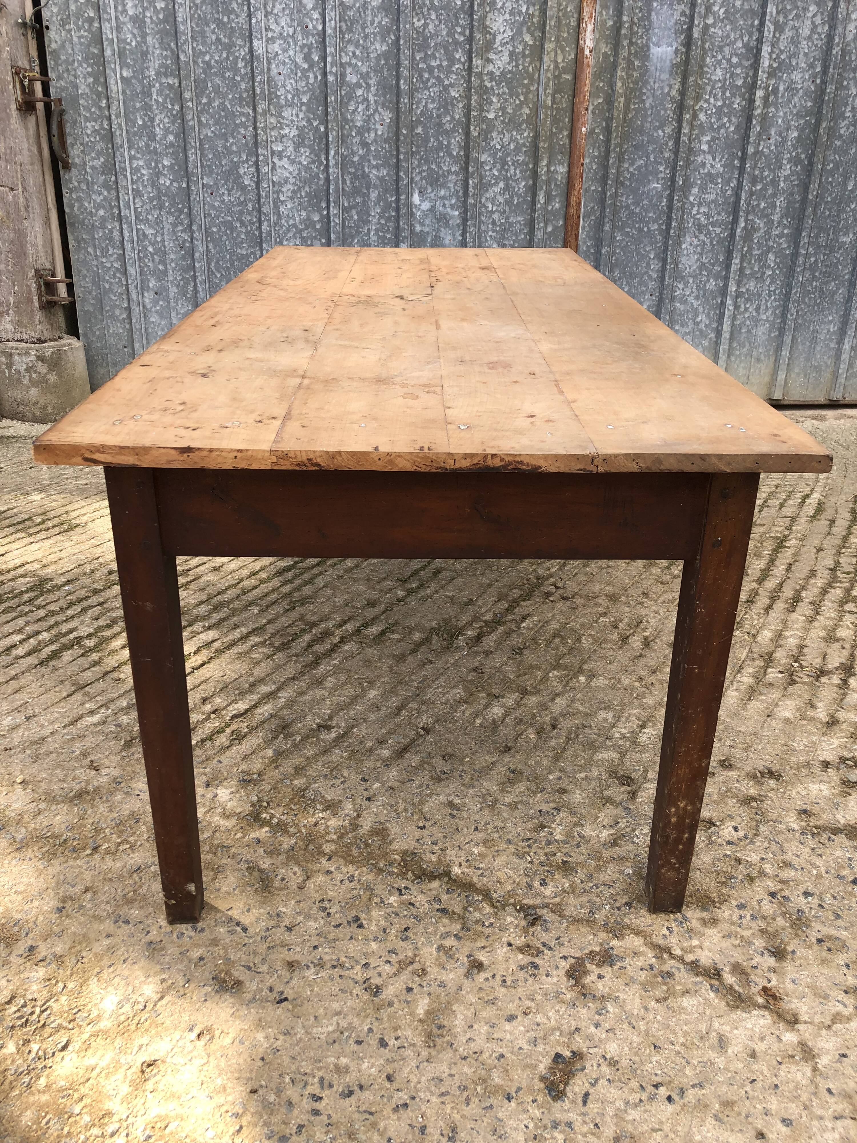 Rustic antique farmhouse table in solid cherry wood.
