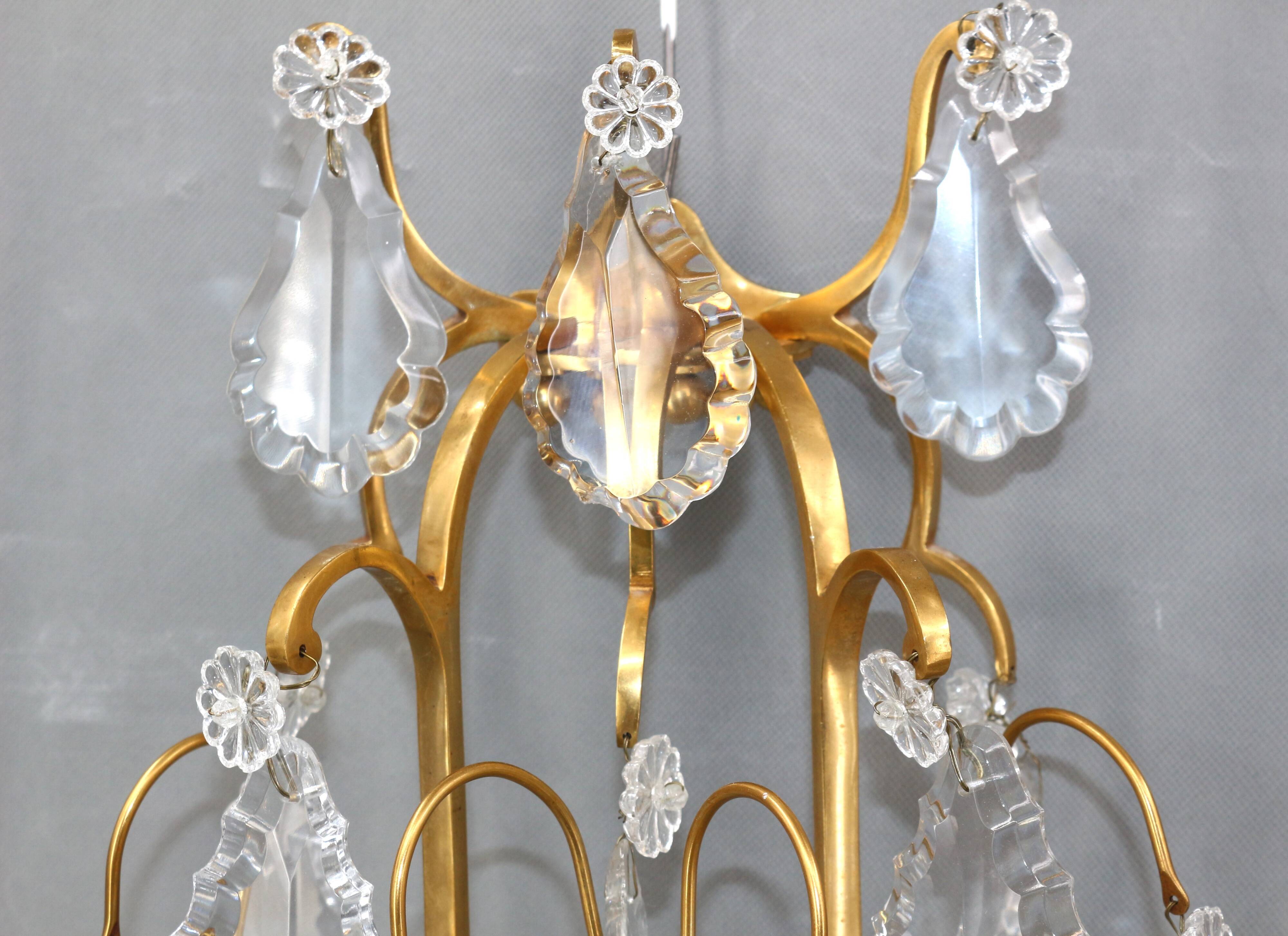 Pair of Louis XVI style gilded bronze & bohemian crystal sconces