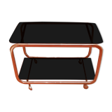 Coffee table with wheels and its two shelves give a smoked