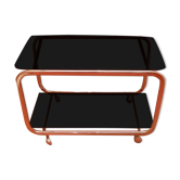 Coffee table with wheels and its two shelves give a smoked