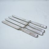 Set of four silver metal knives