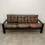 Living room sofa and brutalist armchairs in leather and wood, 70s, chalet style