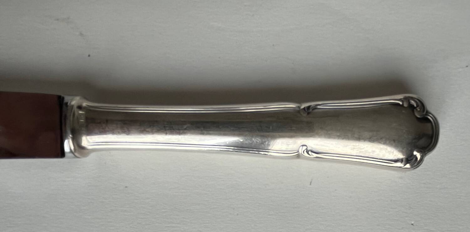 12 silver metal knives