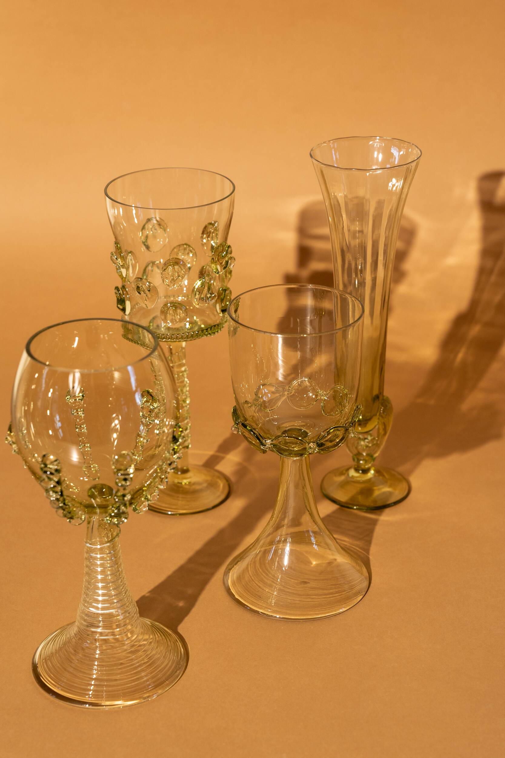 pair of blown wine glasses - green