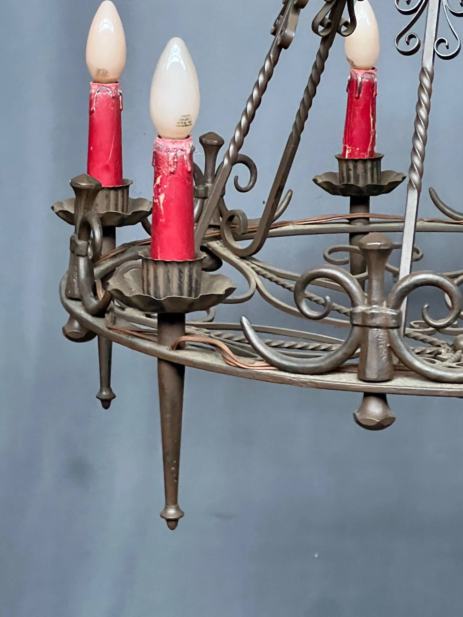 Wrought chandelier in Gothic style.