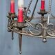 Wrought chandelier in Gothic style.