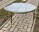Round coffee table in gilded brass with a transparent glass top, 1960s design.
