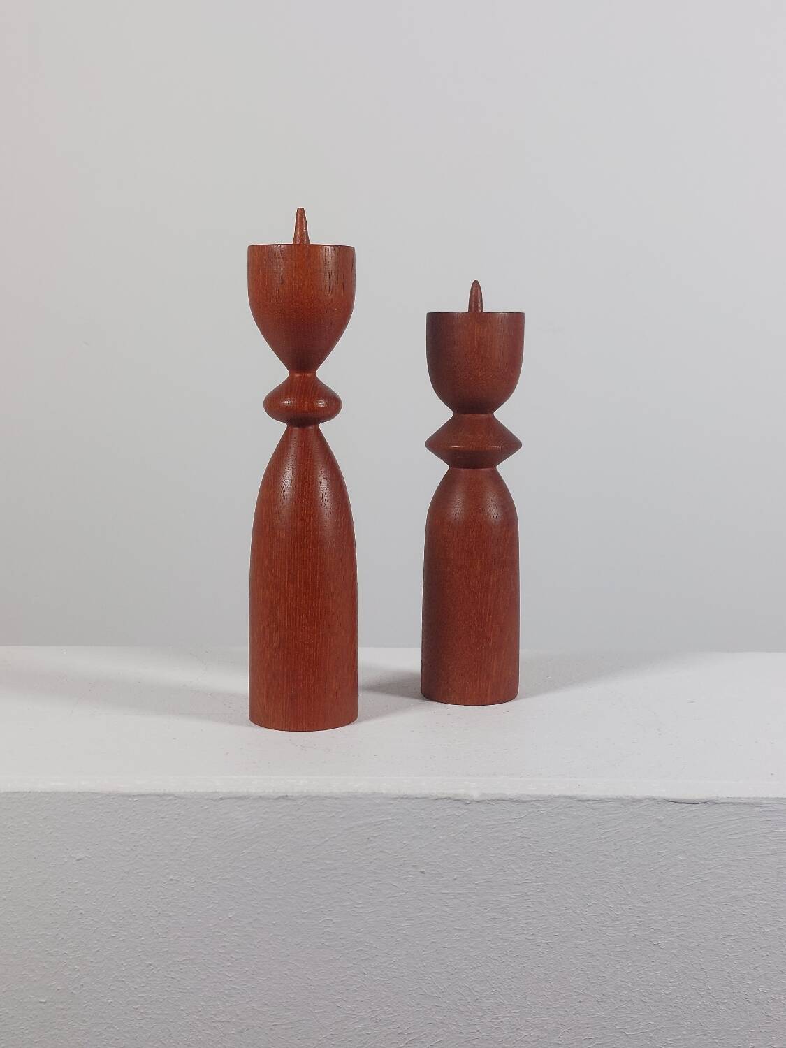 Vintage pair of sculptural teak candlesticks in Scandinavian style.