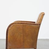 Cognac-colored sheepskin and wooden Art Deco design armchair