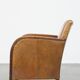 Cognac-colored sheepskin and wooden Art Deco design armchair