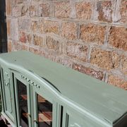 Renovated vintage sage green enfilade – wooden legs & bevelled display cabinets