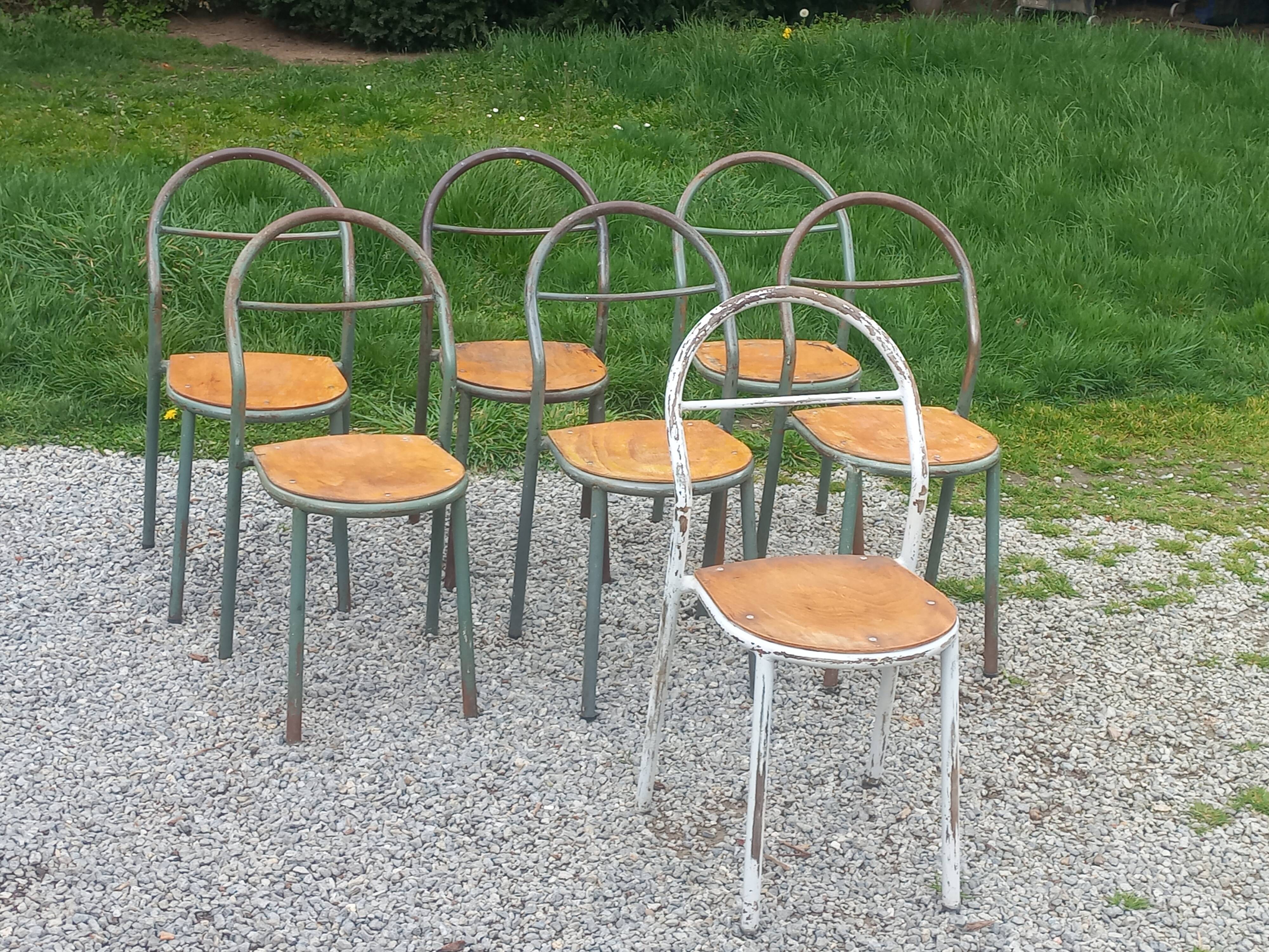 Set de 7 chaises de René Herbst métalliques assises bois