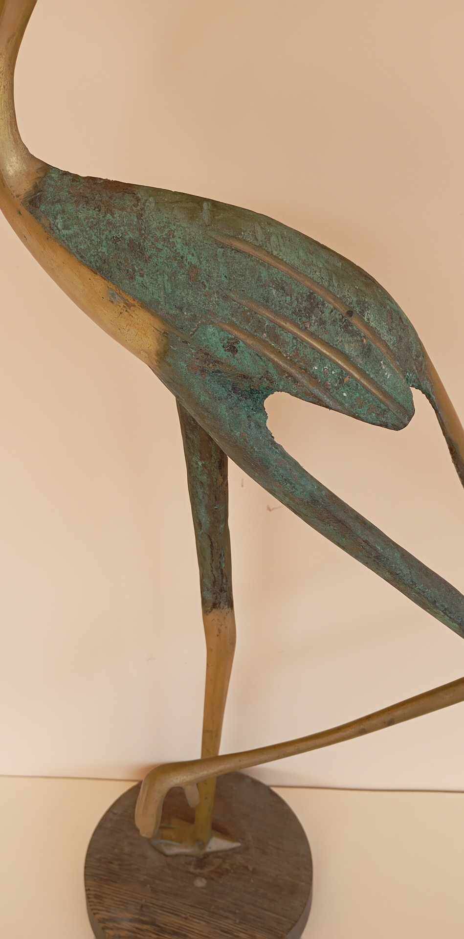 Bronze bird sculpture