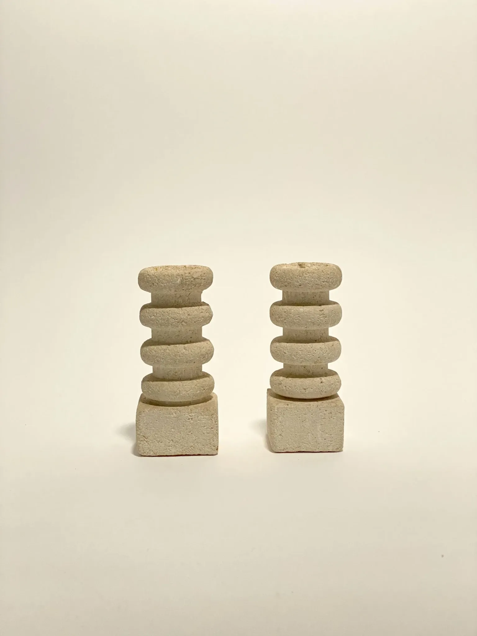 Pair of stone candle holders