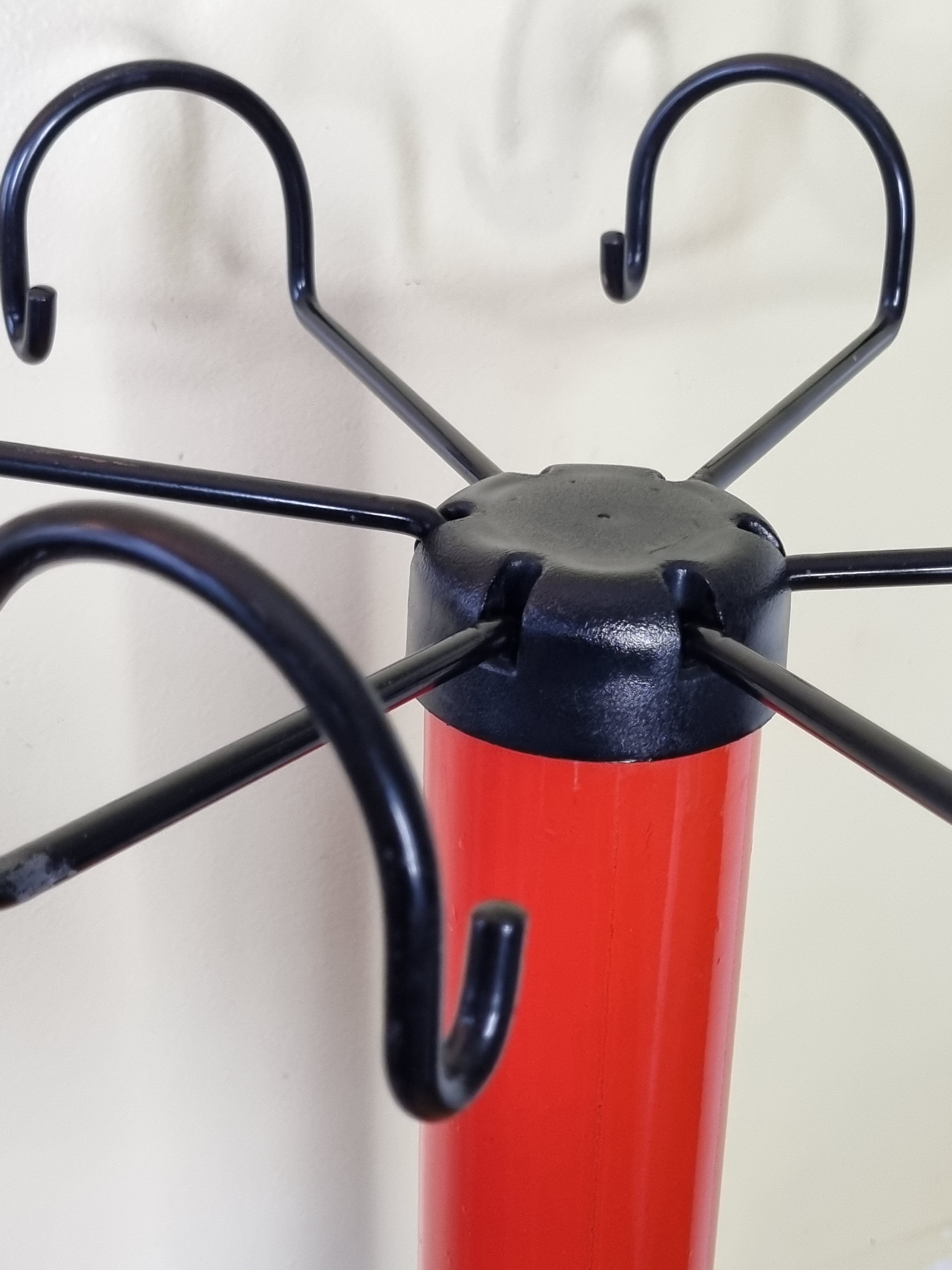 Coat rack in orange lacquered metal published by Seccose, 80s