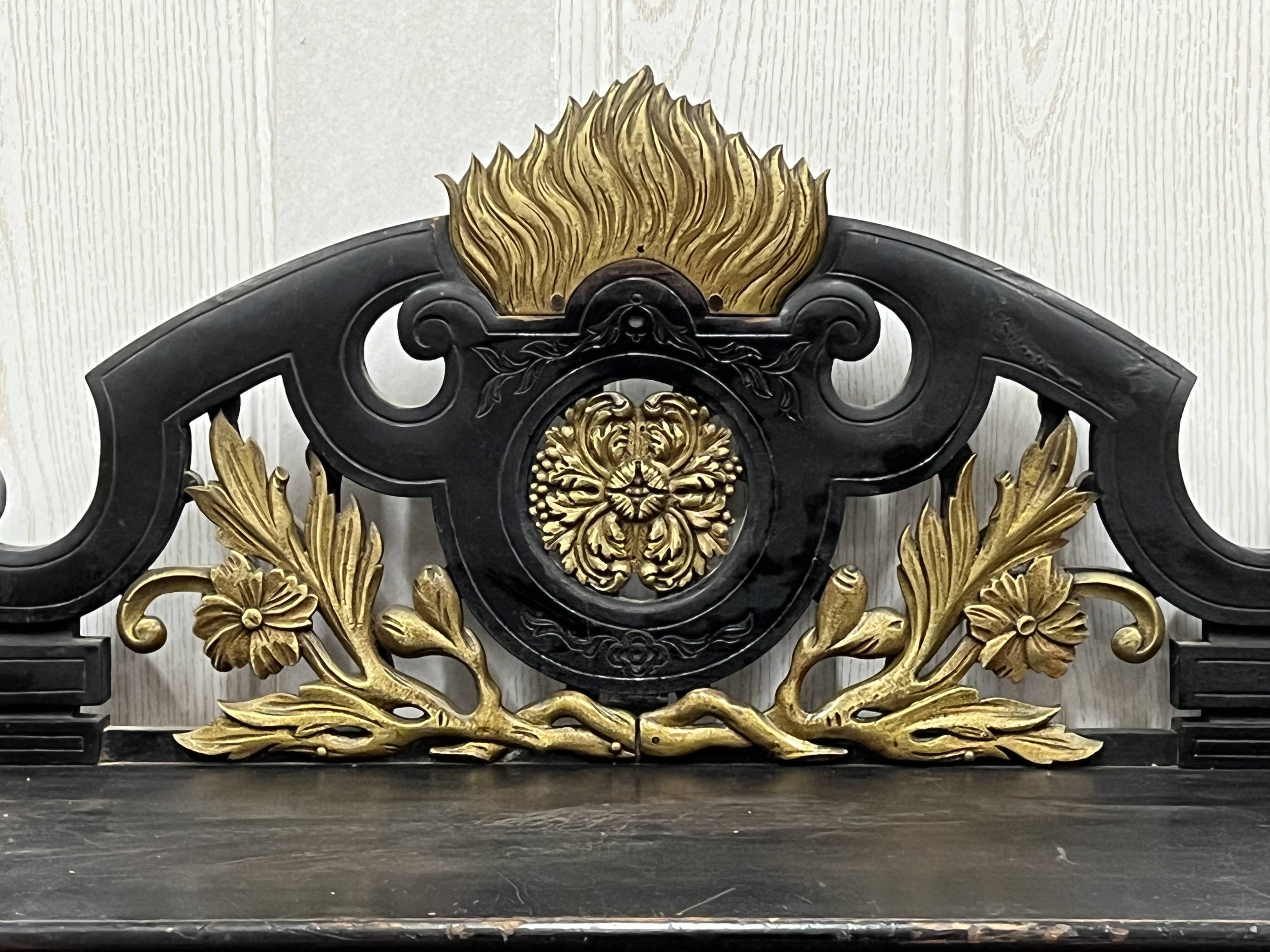 Blackened wooden shelf.