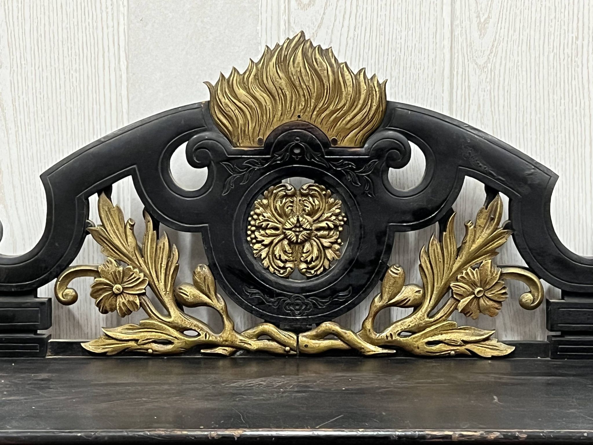 Blackened wooden shelf.