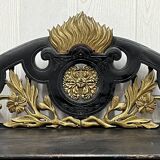 Blackened wooden shelf.