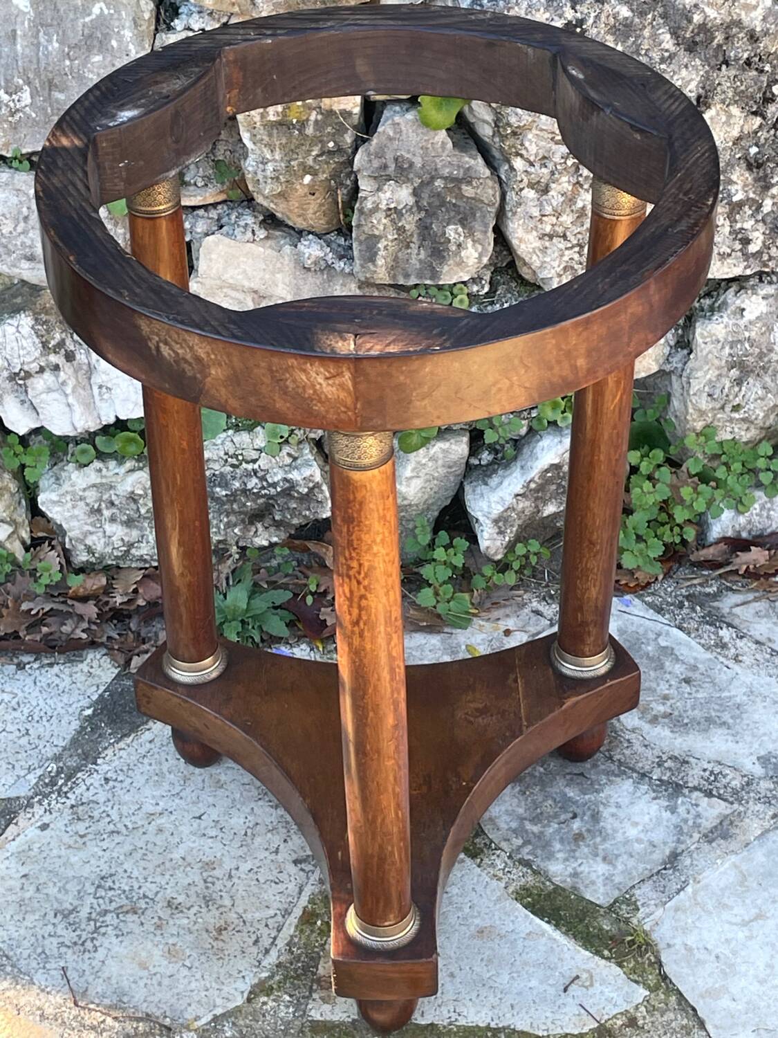 Empire style mahogany and mahogany veneer tripod pedestal table