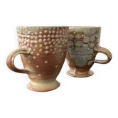 Set of 2 enamelled stoneware mugs with stylised polka dots.