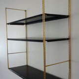 Modular wall shelf in twisted brass